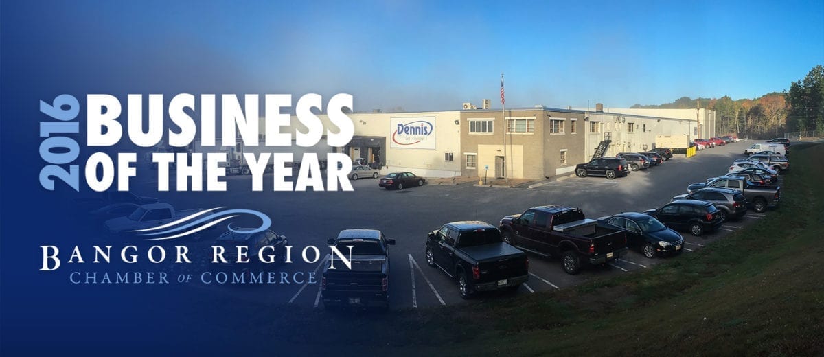 Business of the Year banner in front of Dennis Paper warehouse