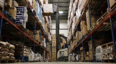 food warehouse aisle with fork lift