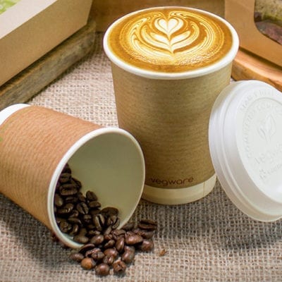 kraft paper coffee cups with coffee beans and latte foam