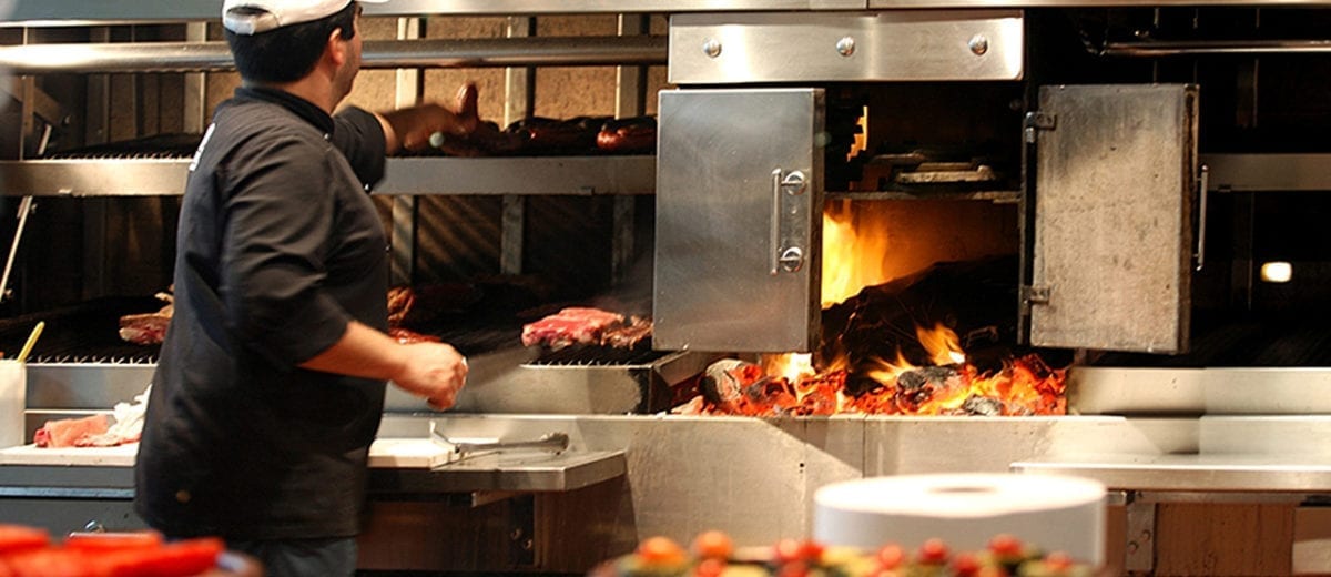 man grilling in restaurant kitchen