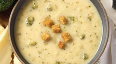 broccoli cheddar soup in a bowl with croutons