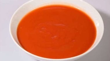 tomato soup in a white bowl