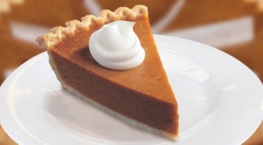 pumpkin pie slice with whip cream