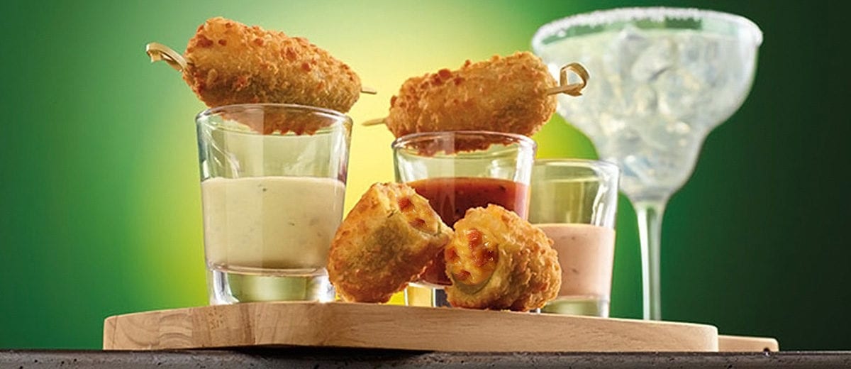 bacon cheddar jalapeno poppers with sauces in shot glasses