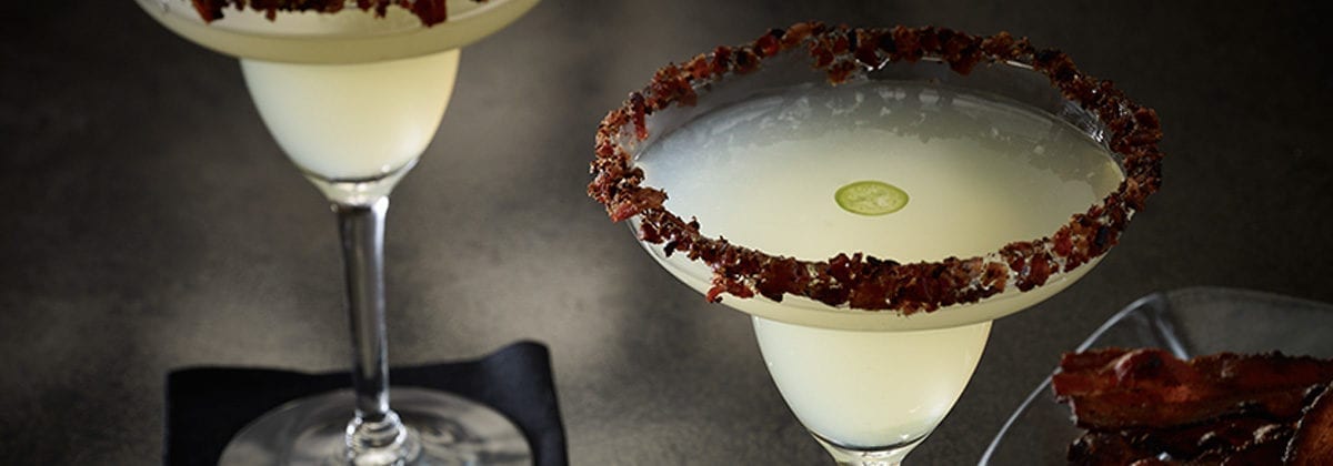 margarita with jalapeno slice floating in it and bacon on the rim. mmm, bacon