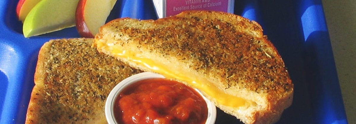 herb grilled cheese sandwich on school tray