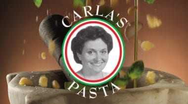 carla's pasta logo with pine nuts falling backdrop