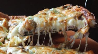 melted cheesy pizza slice