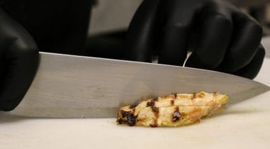 chef's knife cutting chicken