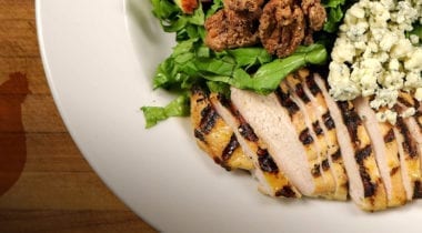 sliced grilled chicken with salad