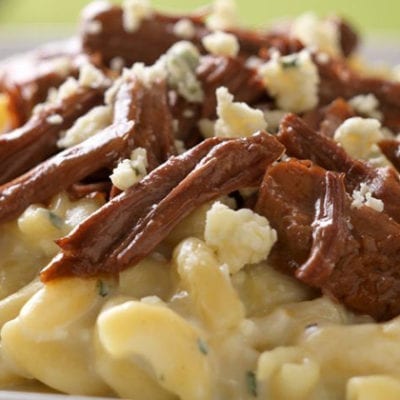 macaroni and cheese topped with shredded beef