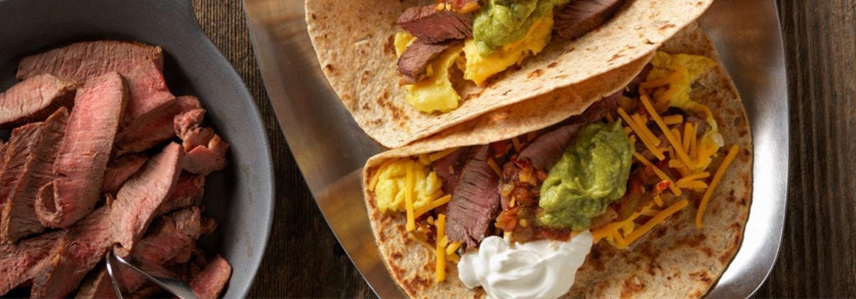 beef taco with guacamole cheese and sour cream