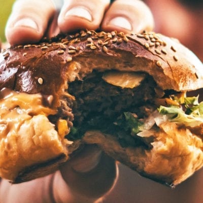 hand holding burger