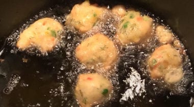shrimp fritters frying in pan 