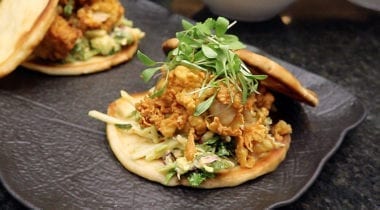 fried clams with greens on naan