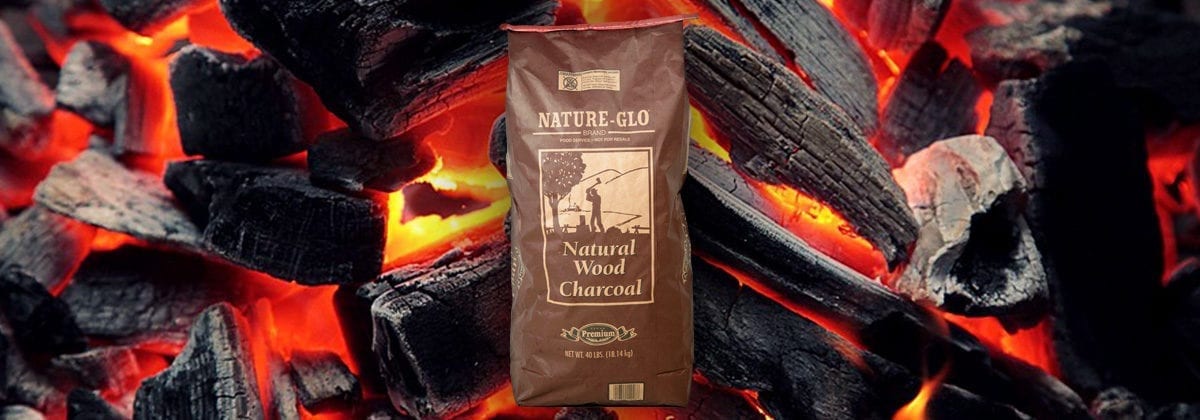 nature glow wood charcoal in bag with coals and fire