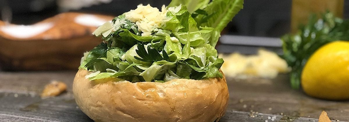 caesar salad in a bread bowl