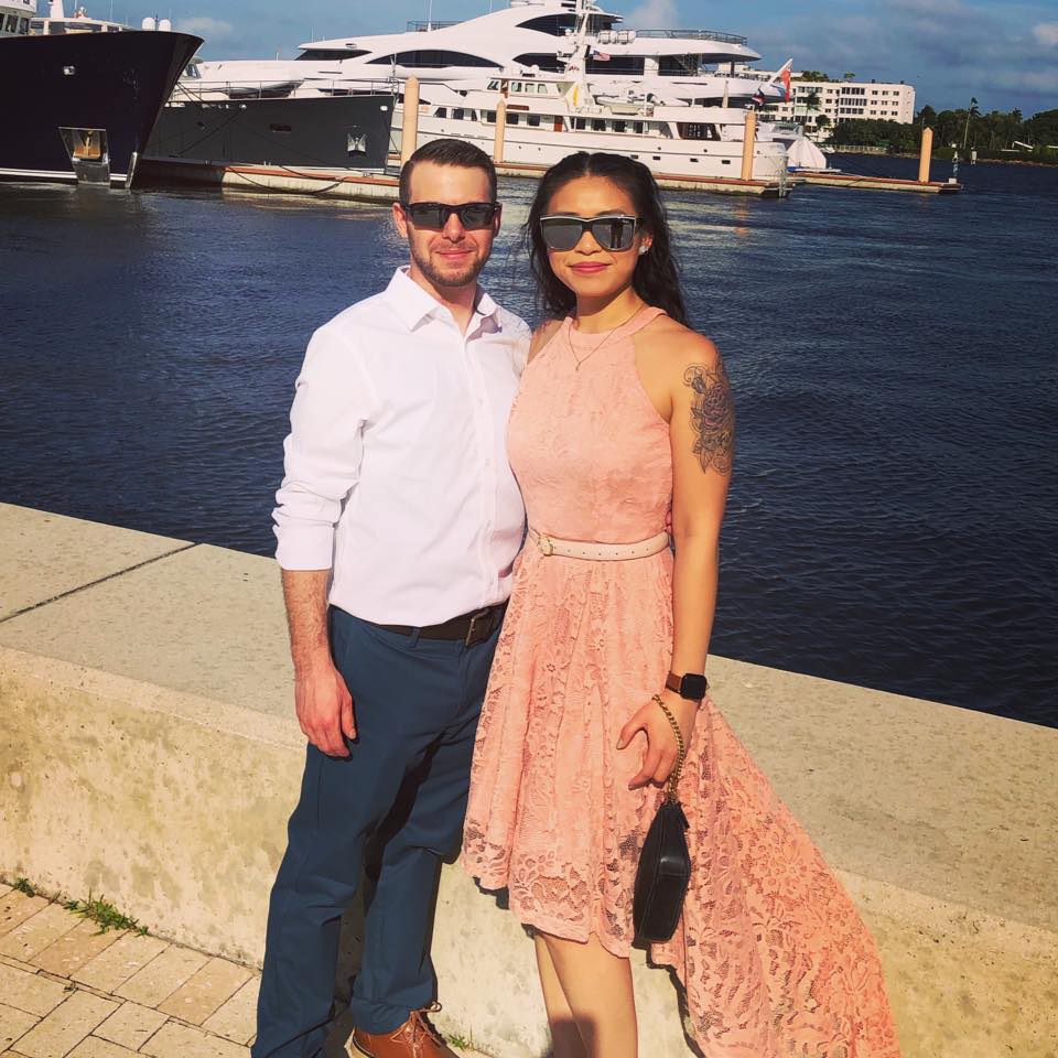 woman and man standing on pier