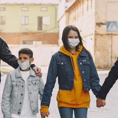 Masked Family walking together