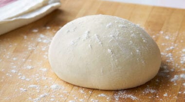 pizza dough ball with flour