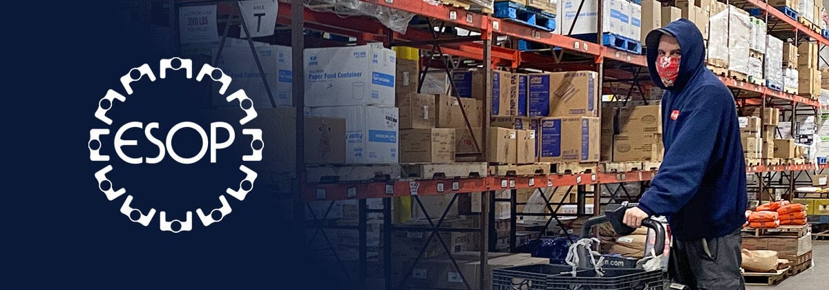 man driving pallet jack in warehouse