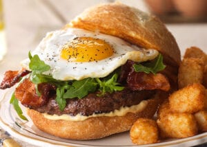 bacon burger with egg. Over easy burger with tater tots