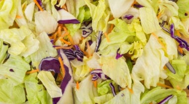 chopped iceberg lettuce with shredded carrot and red cabbage. Salad mix