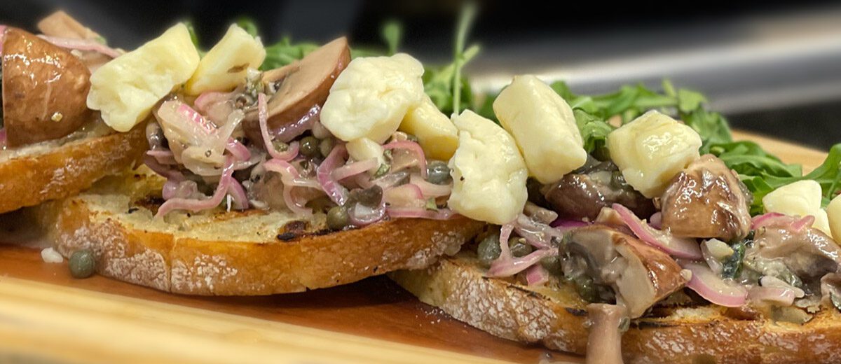 mushrooms, onions, and cheese curds on bread