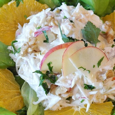 crab salad on lettuce with apple slices and lemons