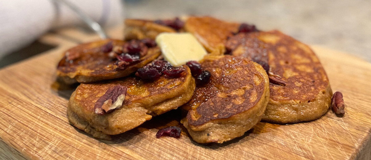 pumpkin cranberry cancakes with butter pat