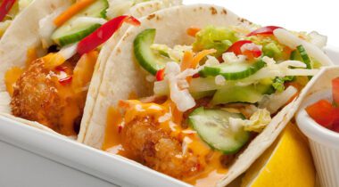 fish tacos on plate, dressed