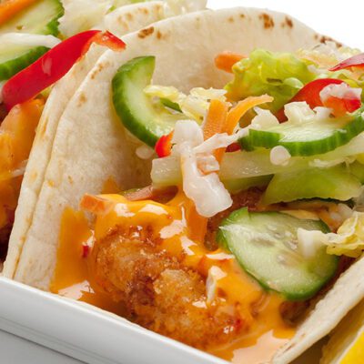 fish tacos on plate, dressed