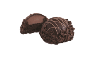 cut chocolate truffle beside whole chocolate truffle