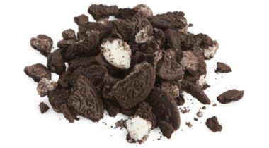 pile of Oreo cookie crumbs over white