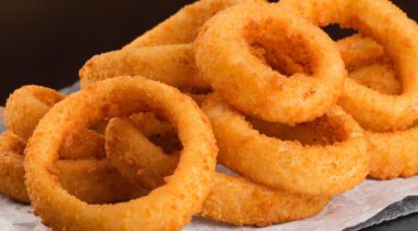breaded onion rings on paper