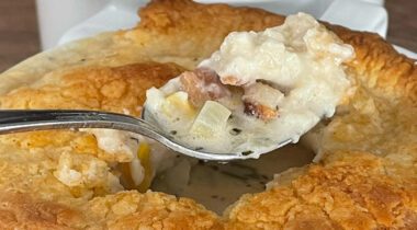 loaded spoon coming out of a pot pie
