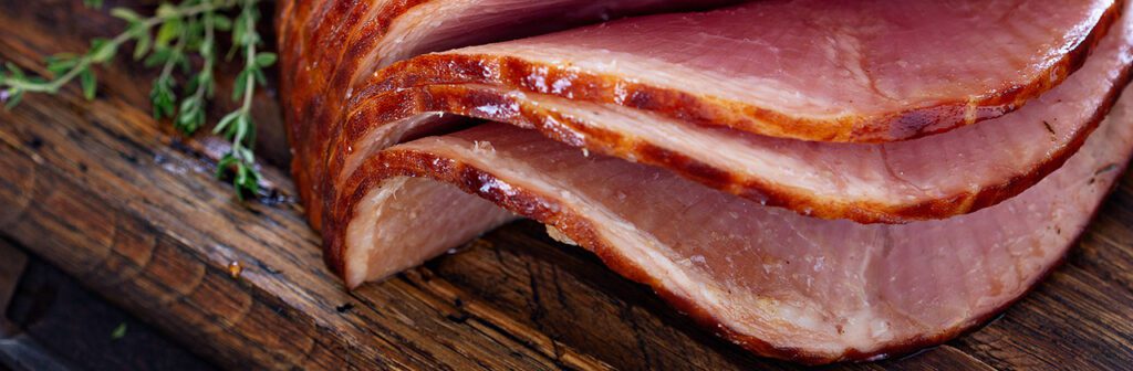 close up of spiral ham on cutting board