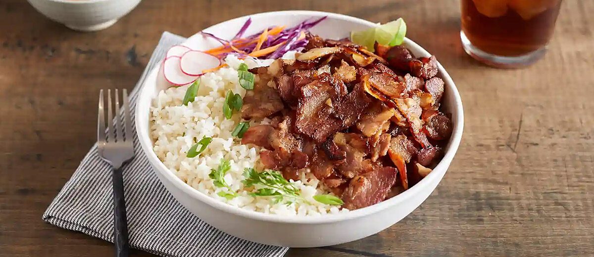 cooked shaved pork belly on a rice bowl