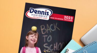 back to school brochure on school desk with notebooks and laptop