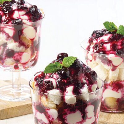 three different glass cups with blueberry desserts