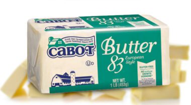 Cabot butter wrapped over out of focus cut pieces of butter