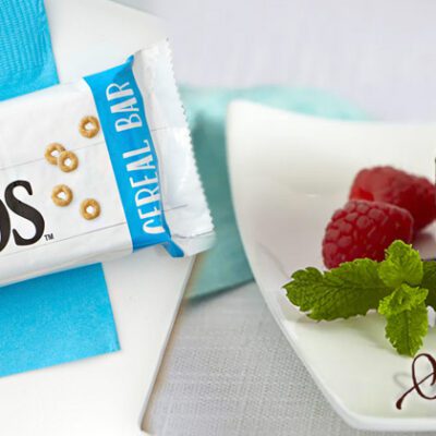 new items graphic with peach cheerios cereal bar and chocolate lava cake on white plate with 2 raspberries and mint leaves