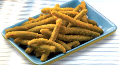 rectangular blue plate of cooked battered green beans