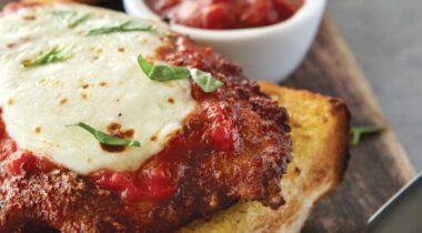 cooked chicken parmesan on toasted bread