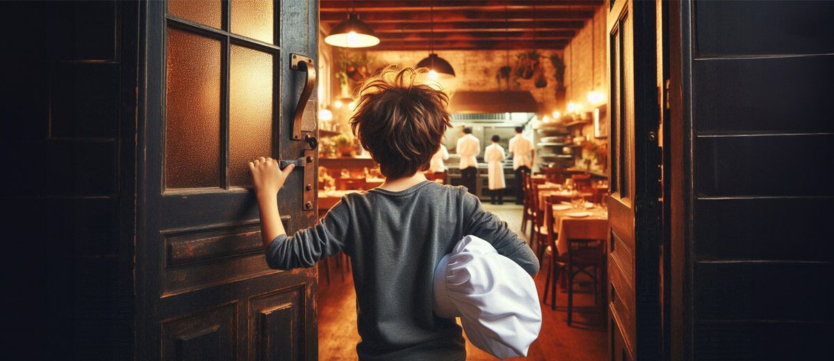 a boy holding a chef's hat peers through a door into a restaurant