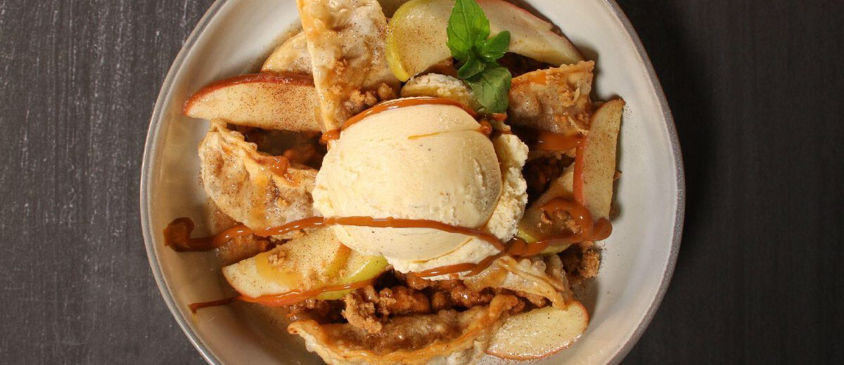 apple crisp prepared with potstickers, scoop of vanilla ice cream