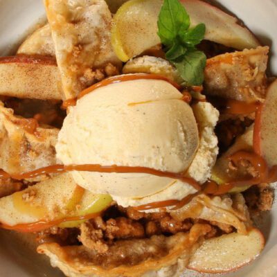 apple crisp prepared with potstickers, scoop of vanilla ice cream