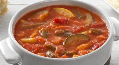 a bowl of Tomato Soup with vegetables