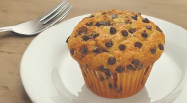 chocolate chip muffin on white plate