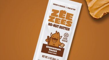 package of Zee Zees No-Nut Butter Cinnamon Toast Flavored over brown background and corner of bread with no nut butter